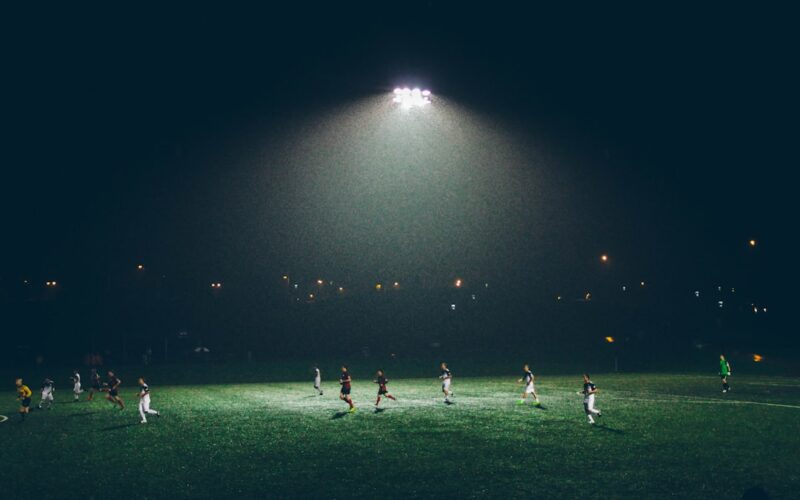 American spectacle global sports — group of people playing soccer on soccer field