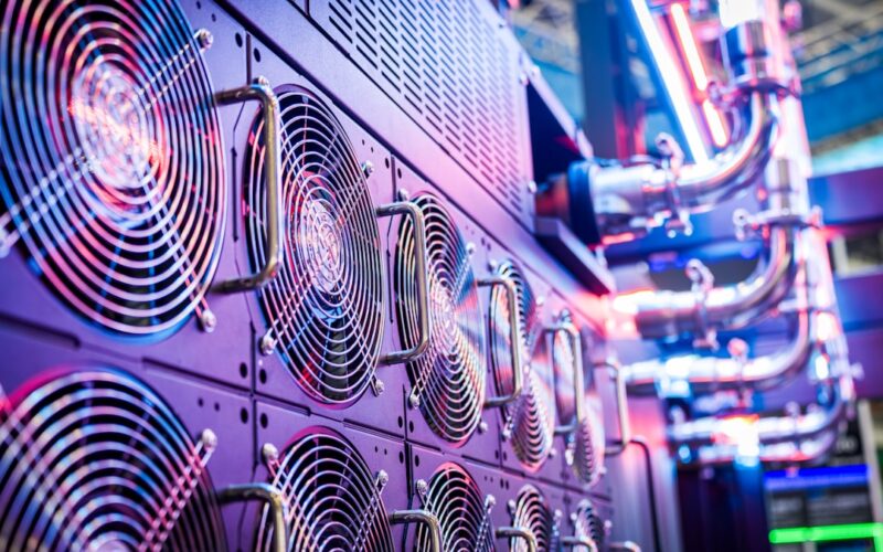 China ai deal — close-up of server cooling fans in a vibrant data center.