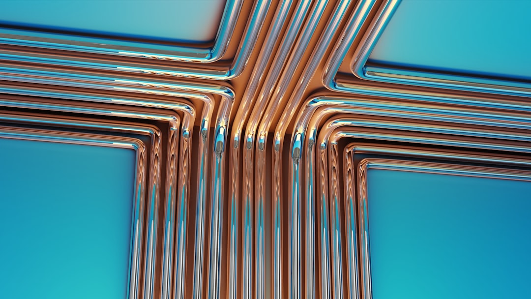 Copper pipes forming a cross shape on blue background