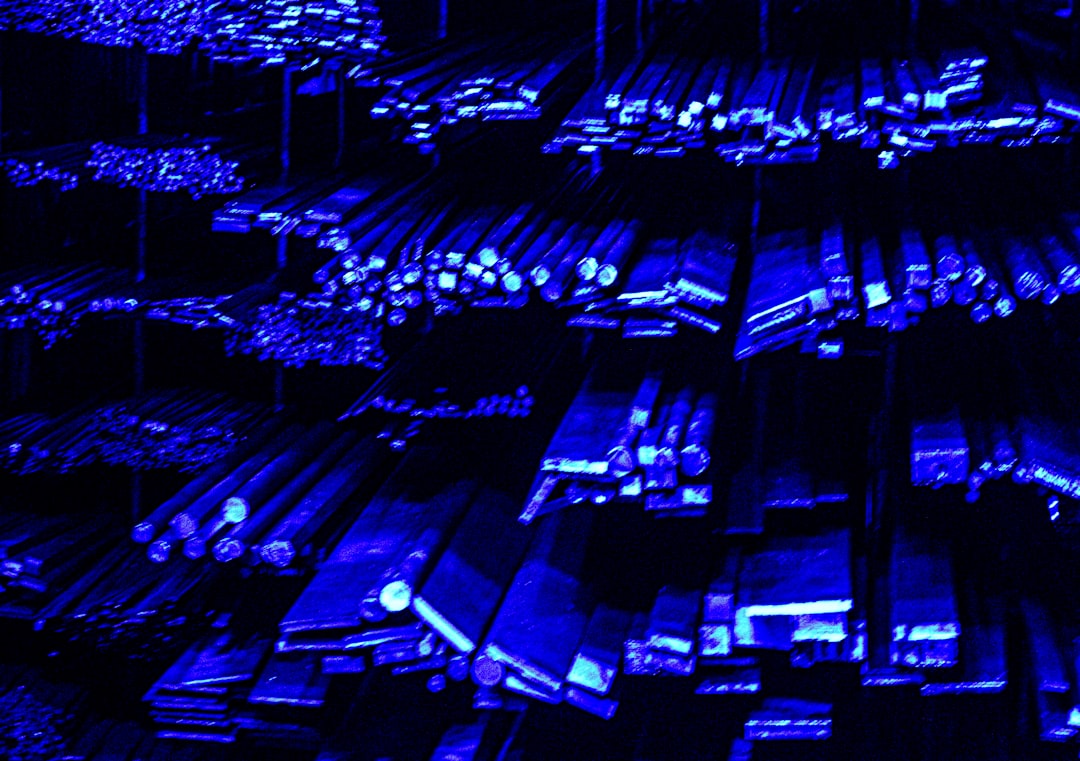 Rows of metal bars illuminated with blue light