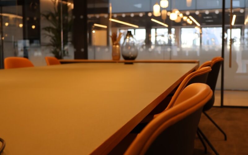 Openai safety leadership — a conference room with a large table and chairs