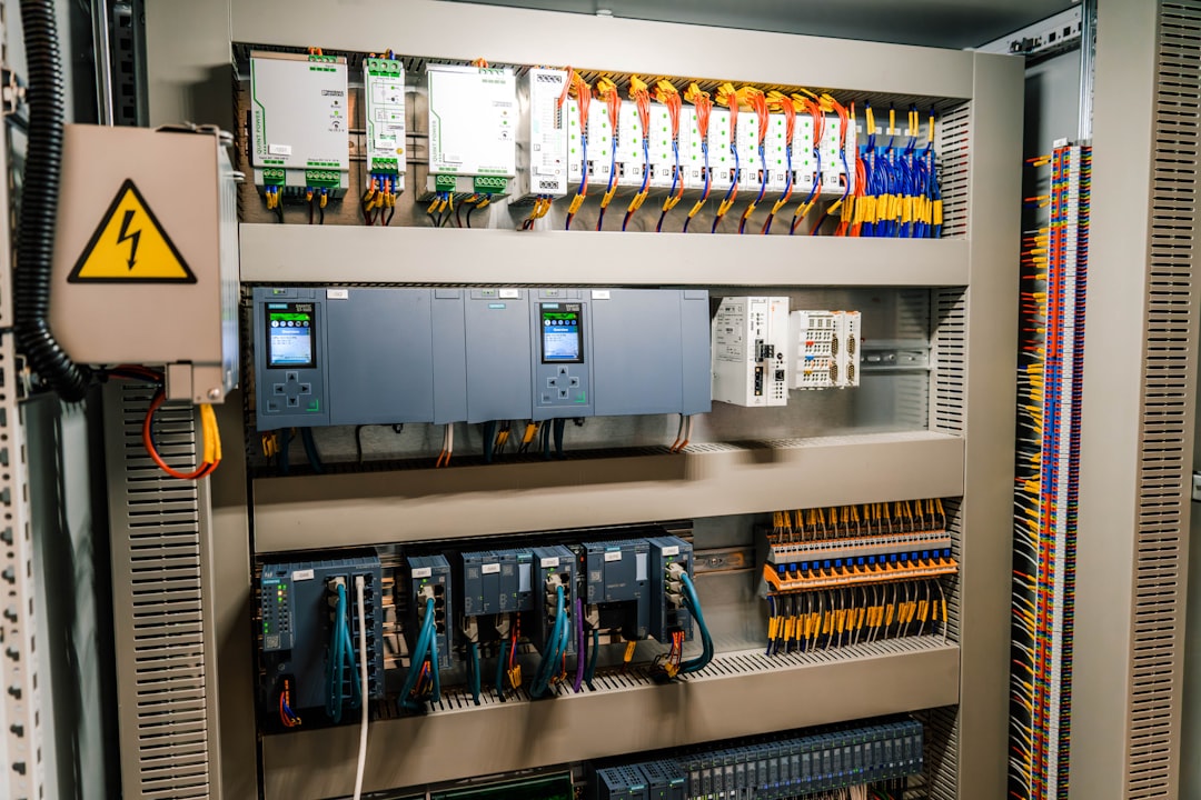 Industrial electrical control panel with wiring and electronic components.